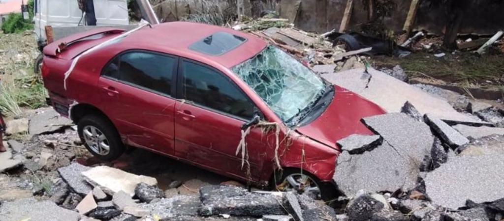 Man Driving in His Car Swept Away by Flood in Abuja Estate 3